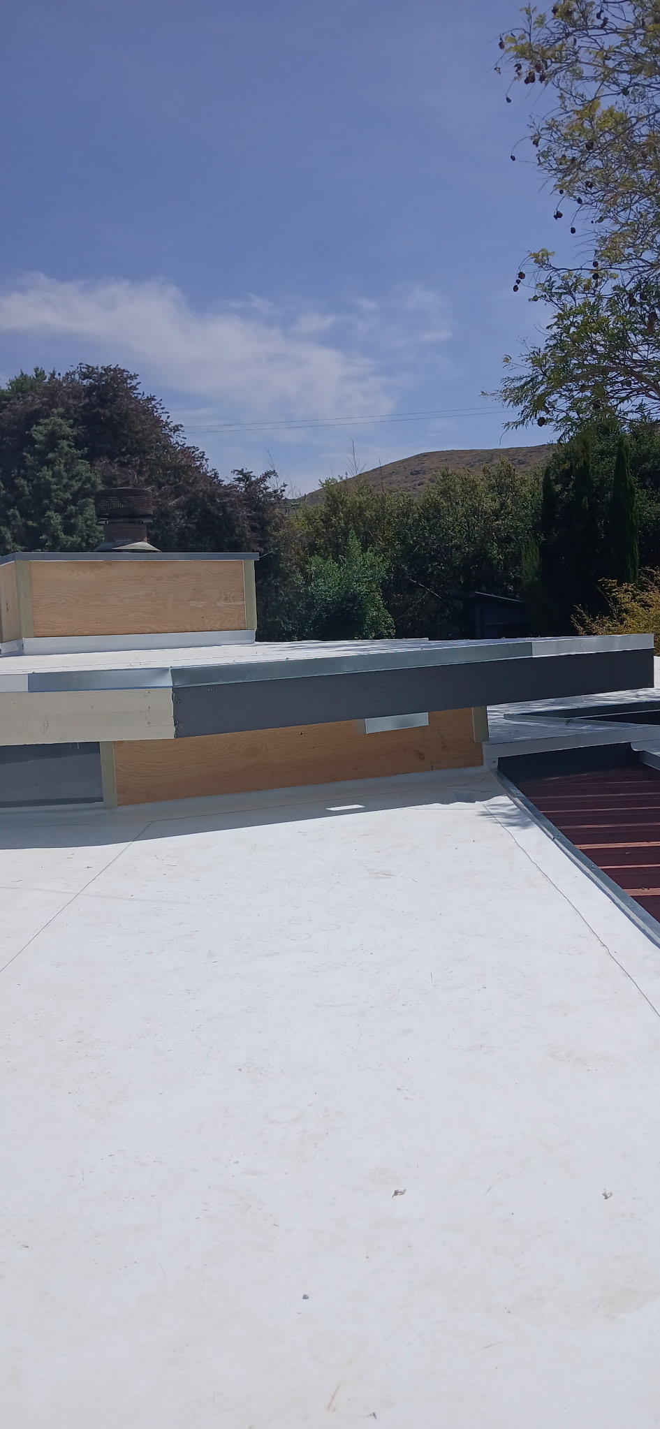 Roofing crew installing a roof on a Central Coast home